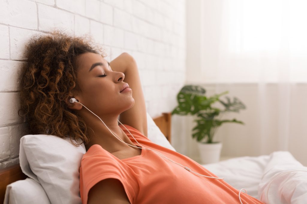 Woman reclining in bed 